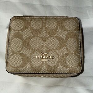 NWT - Coach Tan Monogram Small jewelry box with gold hardware.